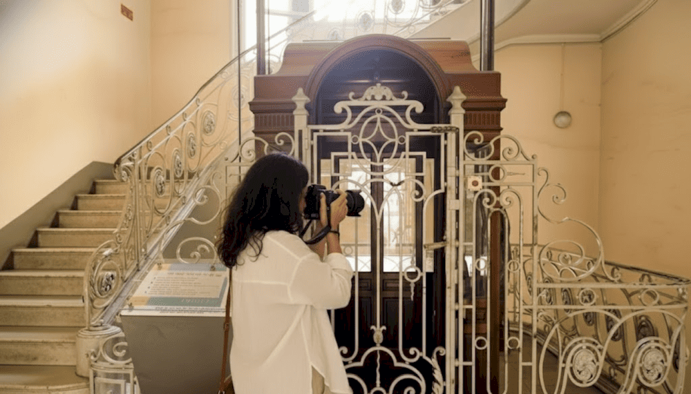 Today, the wooden elevator remains largely unchanged from its original design, standing as a silent witness to the building’s many historical ups and downs